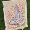 Obraz Budda w lotosach jako dekoracja na tle zielonej trawy